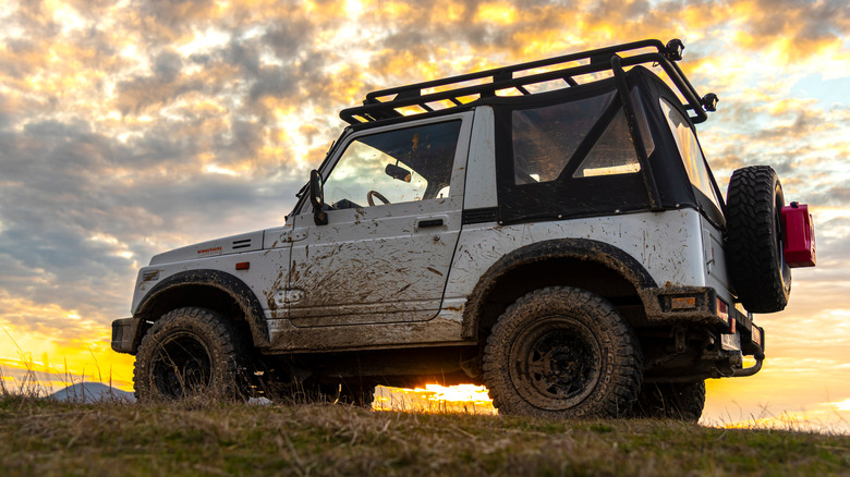 Suzuki Samurai caked in mud