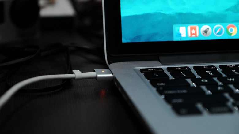 MacBook charging on desk