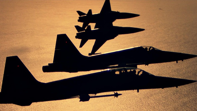 F-5s used in Top Gun flying over the ocean