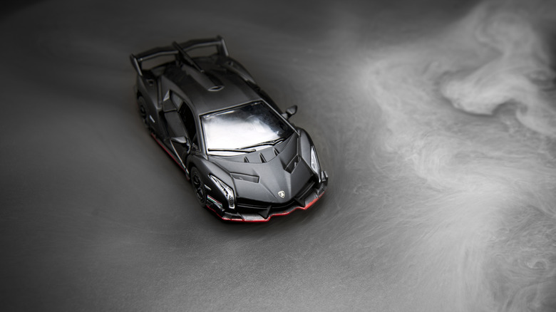 Black Lamborghini Veneno artistic aerial shot