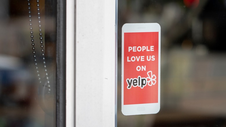 Yelp sticker on store window