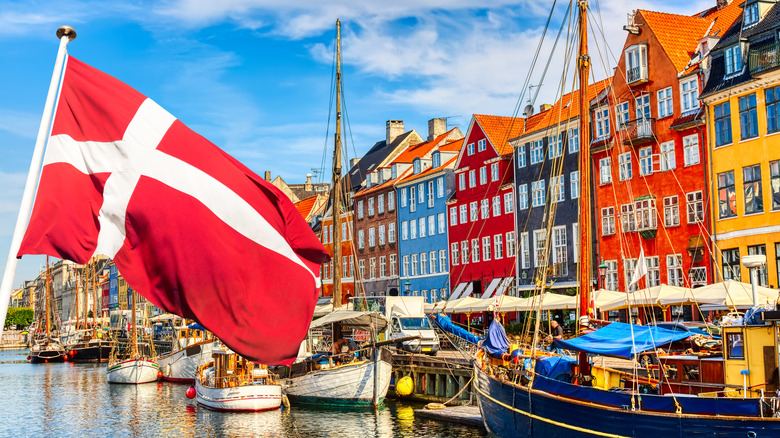 The Danish flag waved near a number of parked boats.