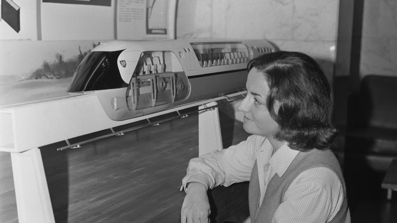 woman examining hovertrain model