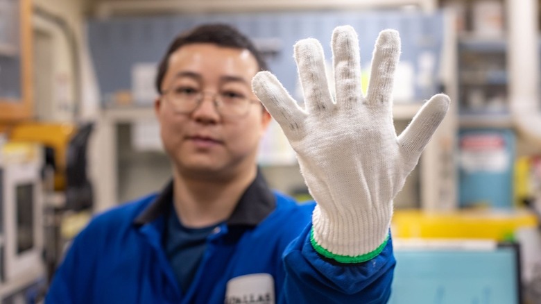 Man wearing nanotech glove