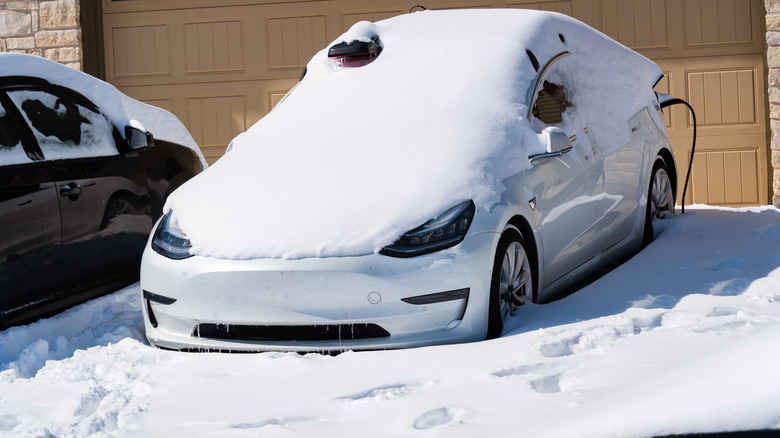 A Tesla car buried in snow