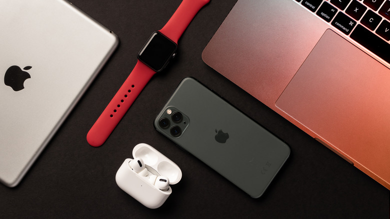 iPad, Apple Watch, iPhone, Air Pods, and MacBook