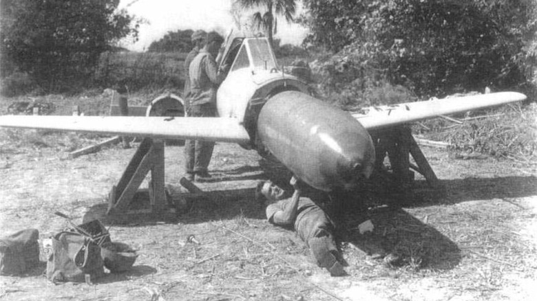 US personnel disarming the warhead of an Ohka at Yontan Airfield in Okinawa, April 1945.