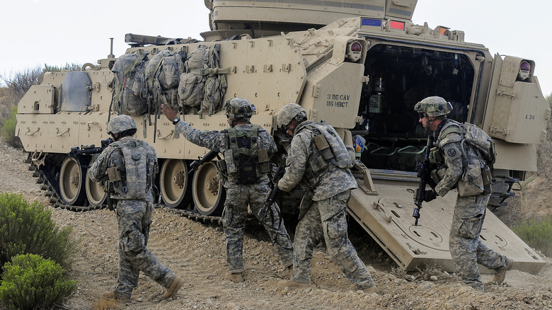 Troops dismounting from a Bradley