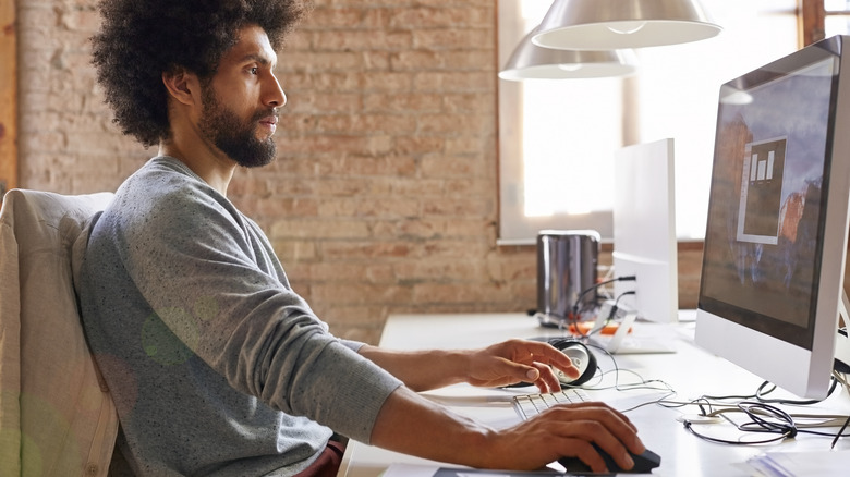 man at computer desk