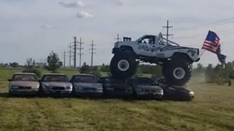 The USA-1 monster truck crushing cars