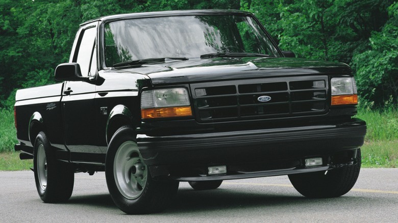 black 1993 F-150 SVT Lightning road driving