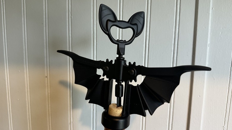 The bat wine bottle opener in use