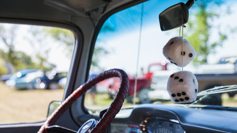 Antique car with fuzzy dice at a show in Massachusetts