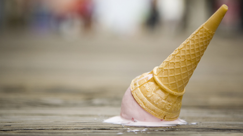 Ice cream melting on pavement