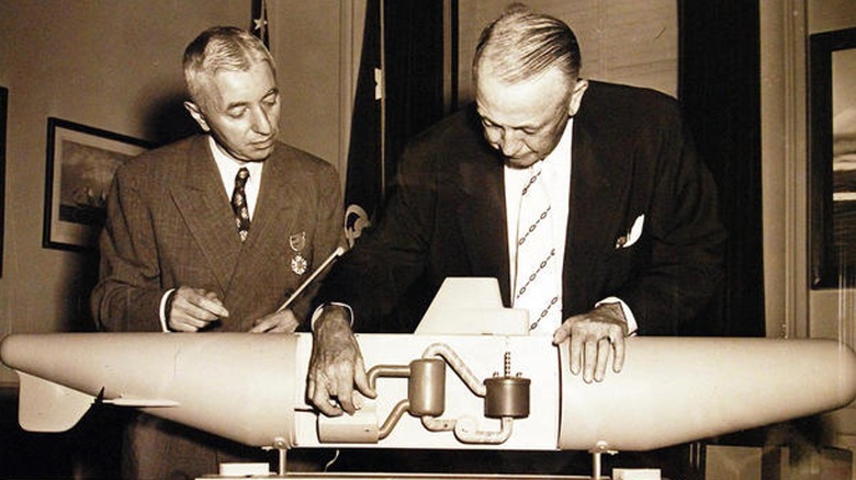 Rickover (left) with model of Nautilus