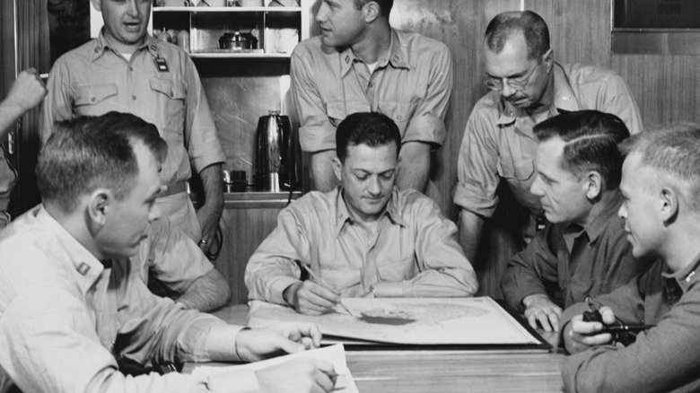  Commander briefs the ship's officers on ice conditions