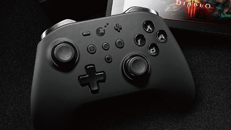 A black GuliKit KingKong 2 Pro Controller