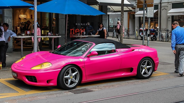 Pink Ferrari parked on street corner in Zürich, Switzerland