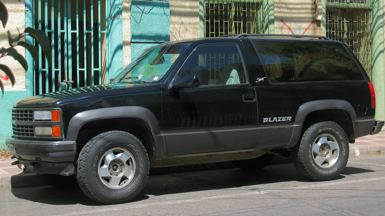 black 1994 Chevy K5 Blazer Sport parked in front of building