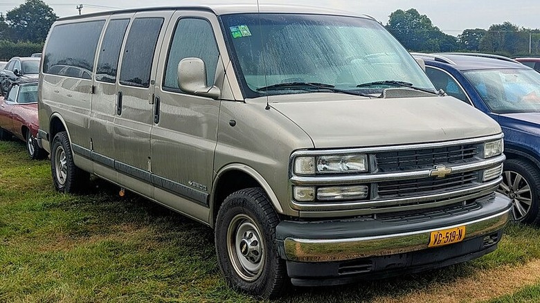 Chevy Express Van in grass parking lot