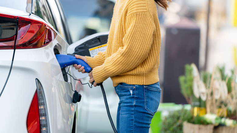 Person charging an EV.