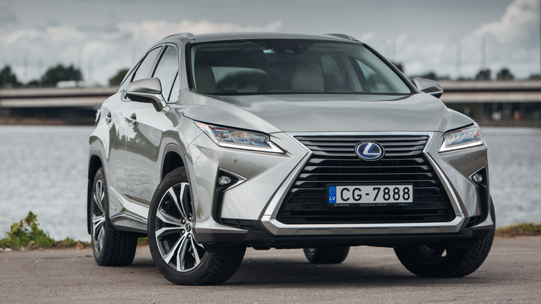 Lexus RX parked by a river