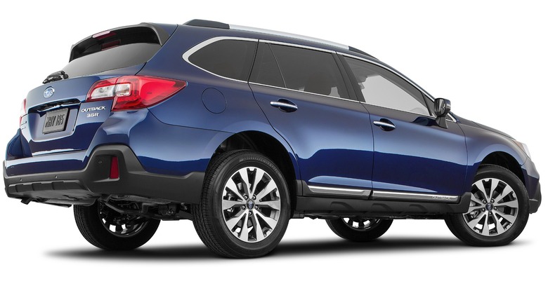 2018 Subaru Outback In Blue Showcasing The Rear And Right Side Of The Vehicle