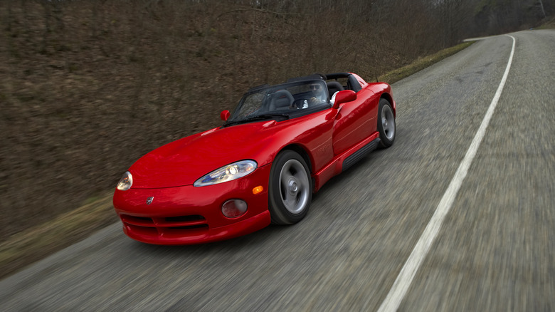 The original Dodge Viper in red driving, front 3/4 view