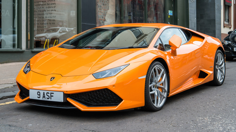 The original Lamborghini Huracan in orange, front 3/4 view