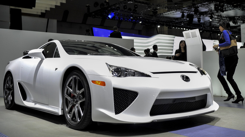 The Lexus LFA at a show floor in white, front 3/4 view