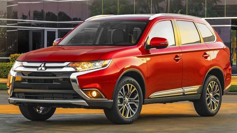 2016 Mitsubishi Outlander In Front Of A Glass Office Building