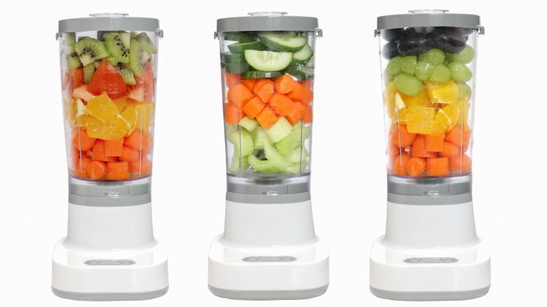 Series of three blenders each filled with fruits and veggies