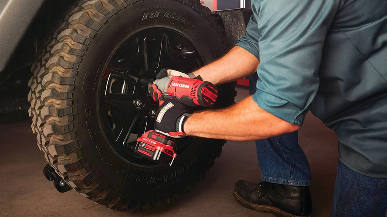 person using Craftsman impact wrench on lugnuts