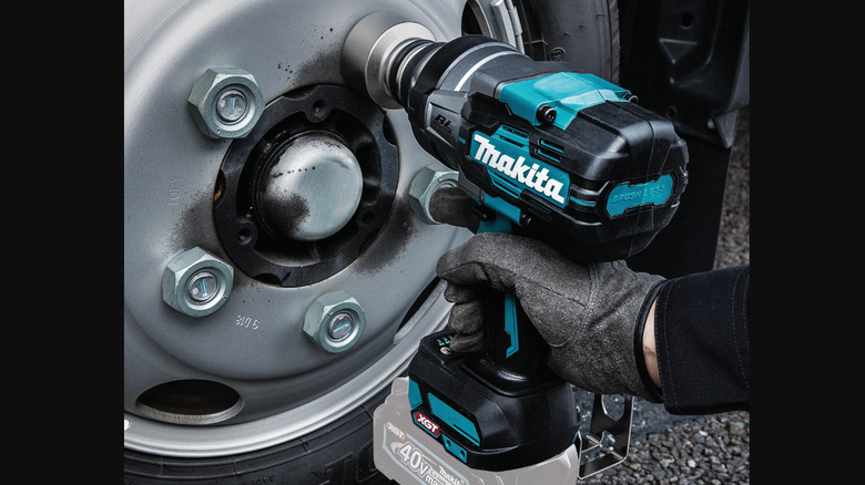 Makita impact wrench being used on lug nuts