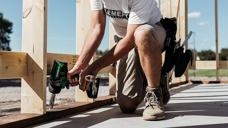 Person using Metabo HPT impact  wrench on fastener