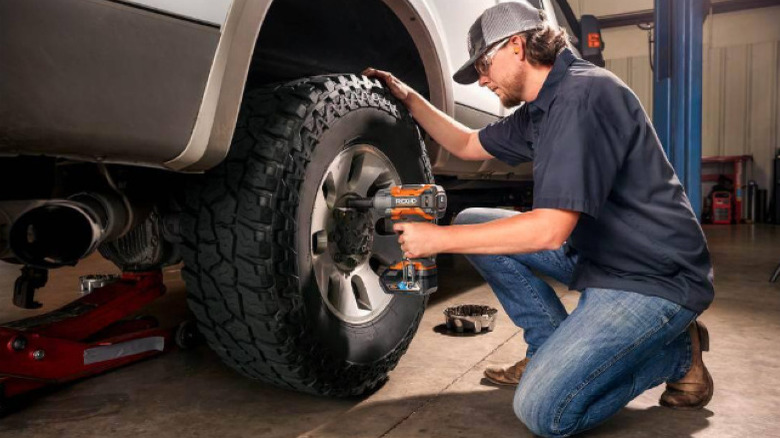 person using Ridgid impact wrench on lug nuts