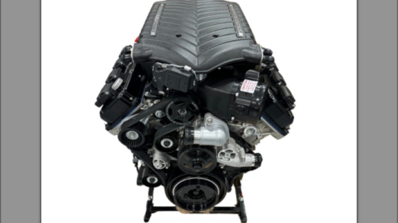 A 1200-hp 426 HEMI on a display stand against a white background.