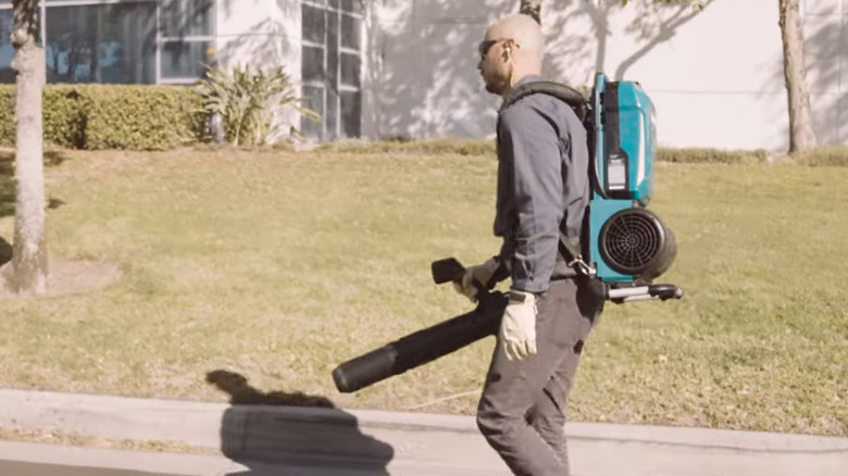 Person using Makita leaf blower