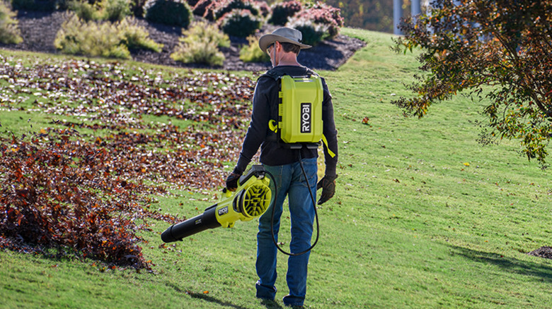 Person using Ryobi leaf blower