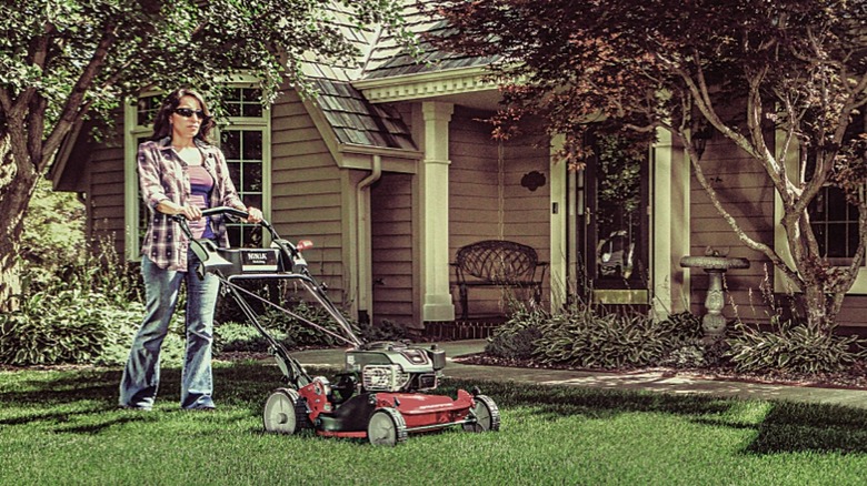 Woman cutting lawn with a Snapper mower