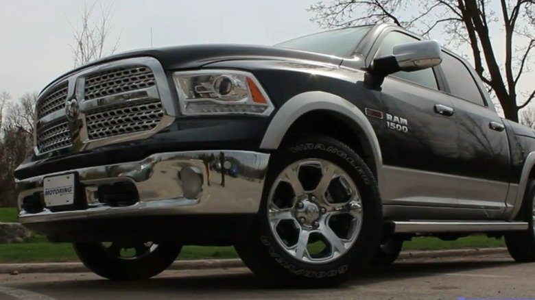 A black 2015 RAM 1500 EcoDiesel parked outside.