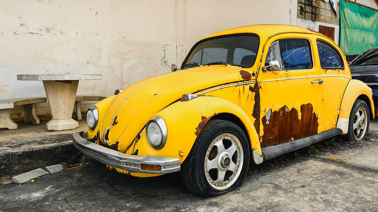 Rusted, damaged Volkswagen Beetle