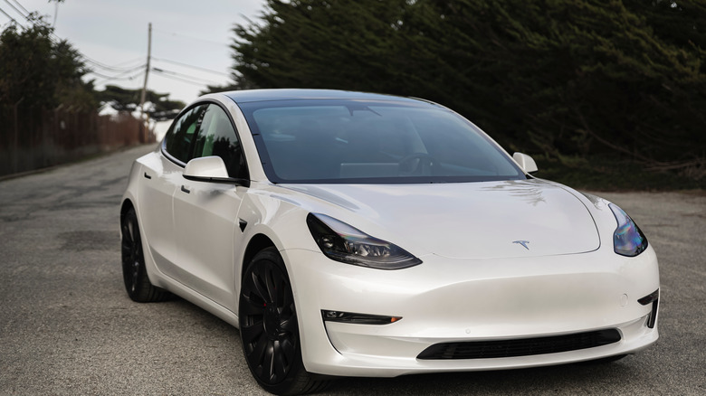 White Model 3 on road