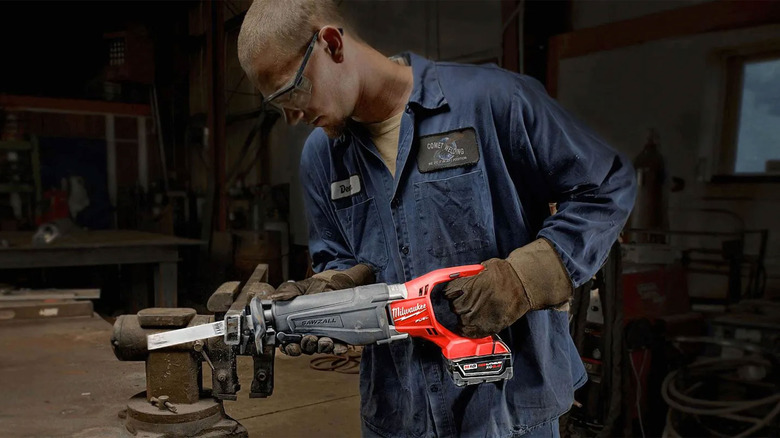 man using a Milwaukee saw