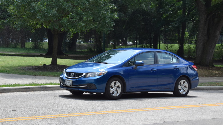 blue Honda Civic on a street