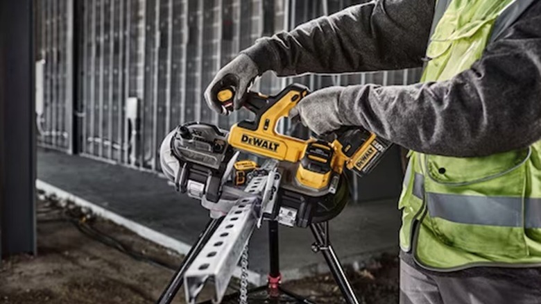 Using a DeWalt cordless bandsaw to cut uni-strut.