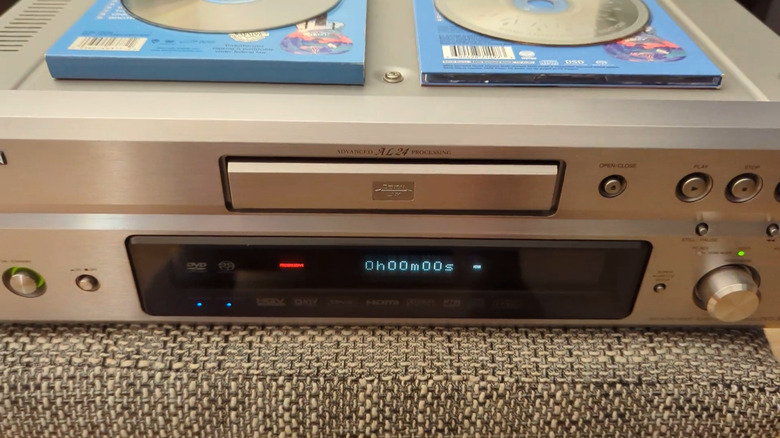 Denon hybrid disc player with an SACD and a DVD Audio disc on top of it