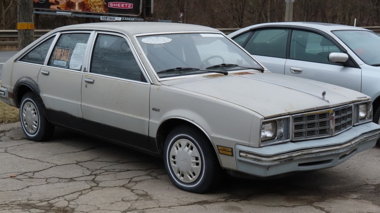 A used 1980 Pontiac Phoenix for sale in a parking lot