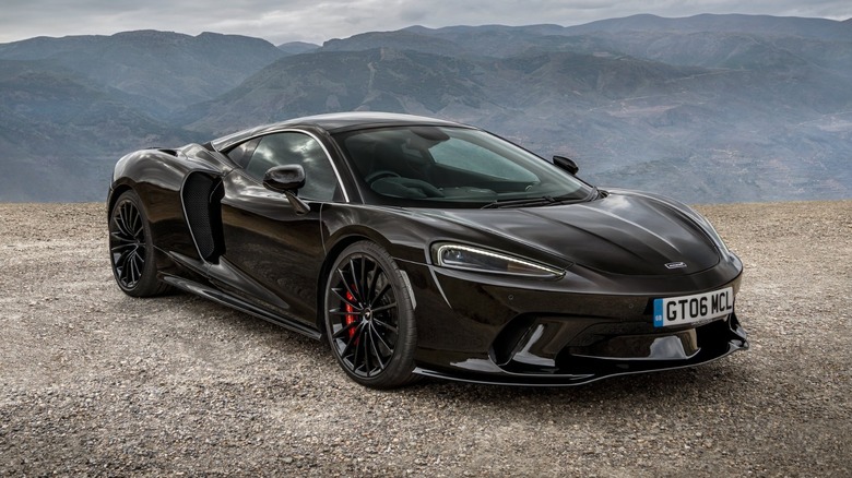 McLaren GT parked on roadside vista