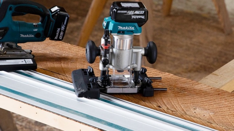 Makita router next to a guide rail